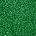 Vibrant green cocktail rimming sugar with coarse, sparkling crystalline texture for drink garnishing.