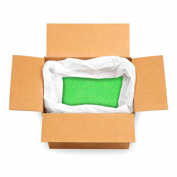 Open cardboard box filled with 132lb of vibrant Heat Green ultrafine UV reactive iridescent craft glitter.