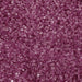 Close-up texture of coarse, sparkling hot pink sugar crystals for cocktail glass rimming.
