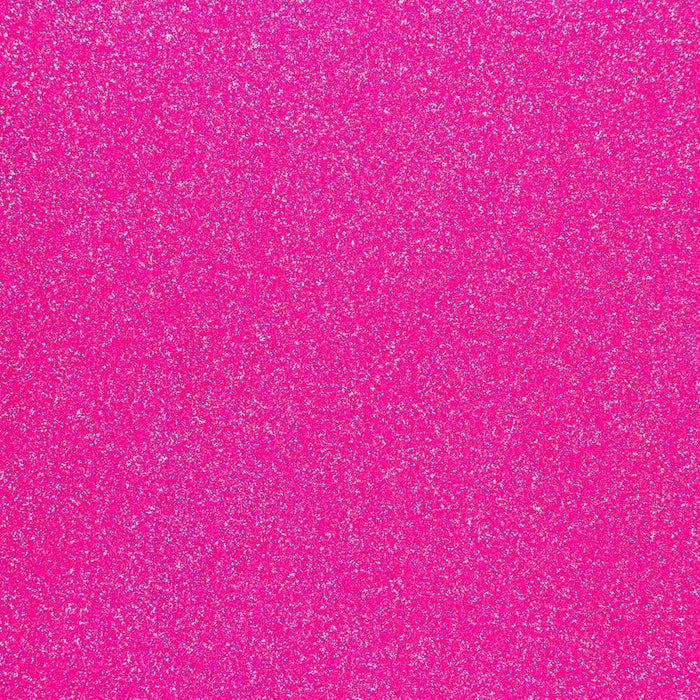 Close-up of hot pink ultrafine UV reactive iridescent craft glitter, showing its sparkling texture.