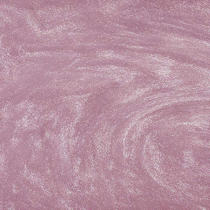 Swirling light pink edible glitter with a shimmering, metallic texture for drinks and desserts.