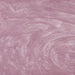 Swirling light pink edible glitter with a shimmering, metallic texture for drinks and desserts.