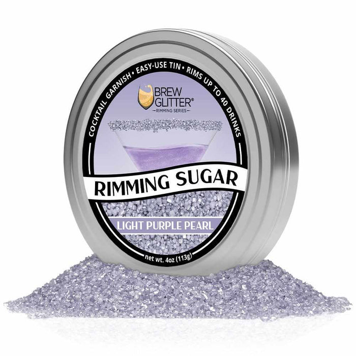 Light purple pearl rimming sugar in a silver Brew Glitter tin, surrounded by loose sugar.