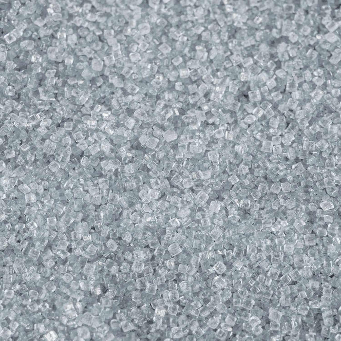 Close-up texture of sparkling light silver pearl cocktail rimming sugar crystals.