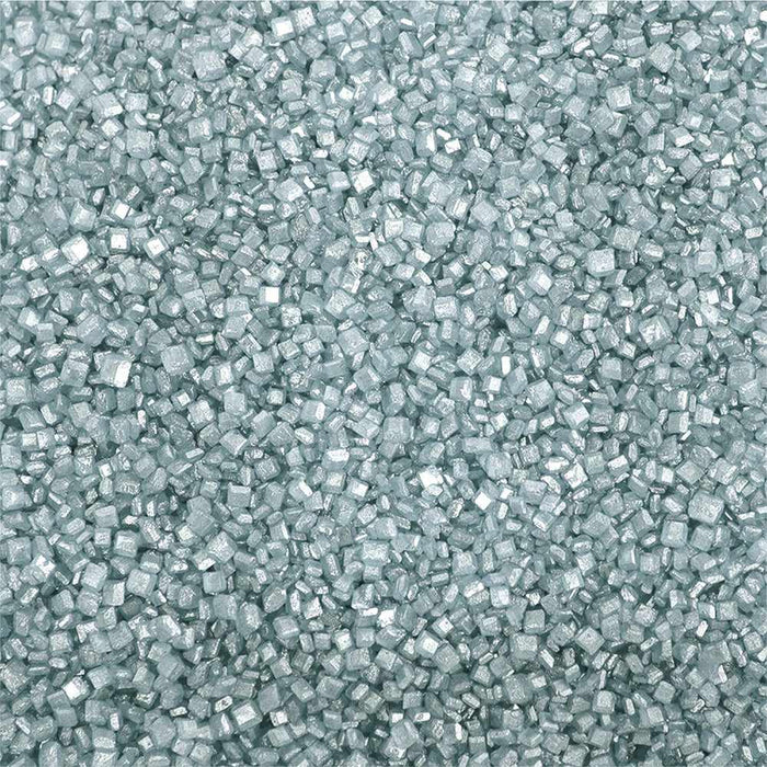 Close-up of sparkling light silver pearl rimming sugar, small square crystals for drink garnishes.