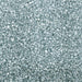 Close-up of sparkling light silver pearl rimming sugar, small square crystals for drink garnishes.