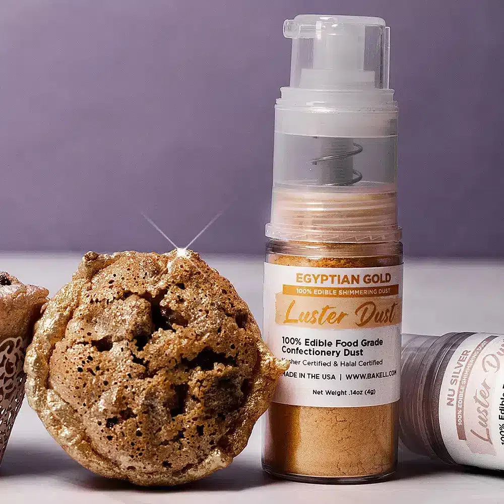 muffin top with gold luster dust next to a spray bottle