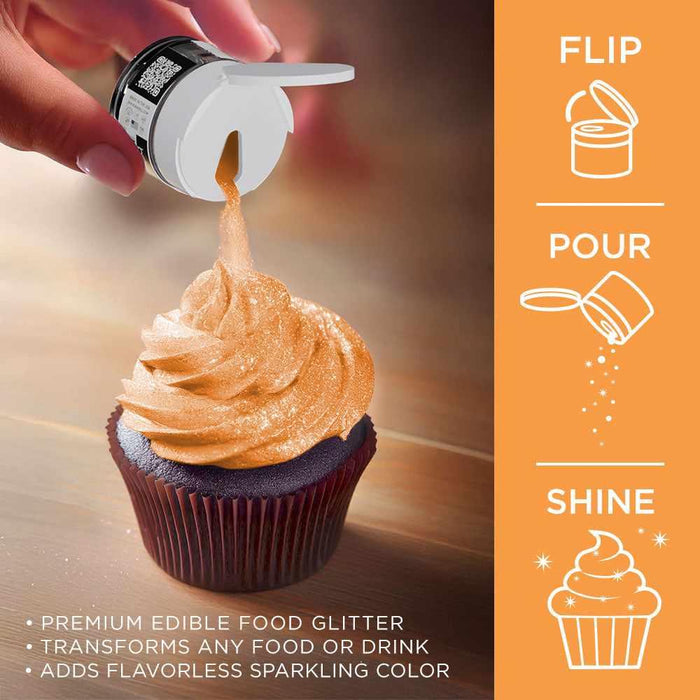 Hand sprinkles neon orange Tinker Dust edible glitter onto a frosted chocolate cupcake.