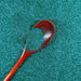 Ocean Blue-Green Ultrafine Metallic Craft Glitter Dazzler Dust with a wooden spoon.