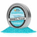 Ocean Blue Rimming Sugar in a round aluminum tin, surrounded by shimmering blue sugar crystals.