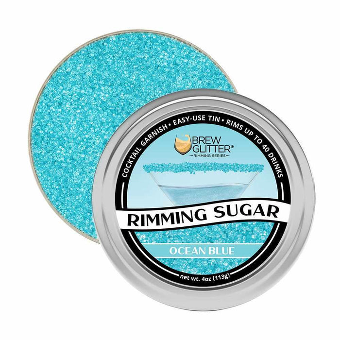 Ocean Blue Rimming Sugar in a round, silver aluminum tin, open to show shimmering blue sugar.
