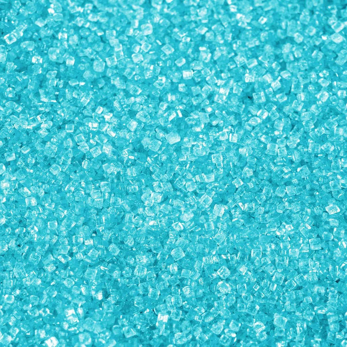 Vibrant ocean blue cocktail rimming sugar crystals with a shimmering, translucent texture for drink garnishes.