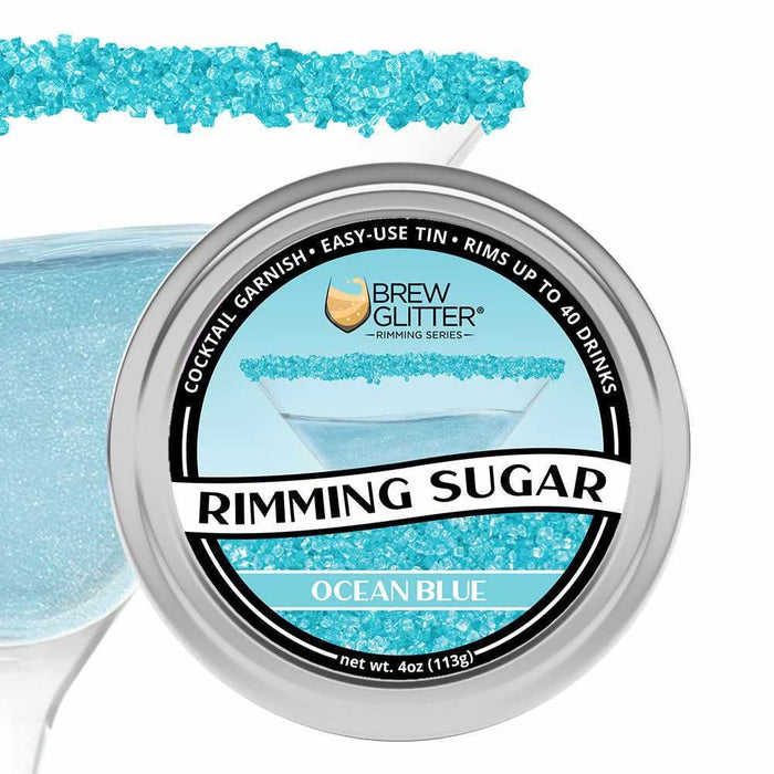 Brew Glitter Ocean Blue Rimming Sugar in a 4oz aluminum tin, with a cocktail glass rimmed in blue sugar.