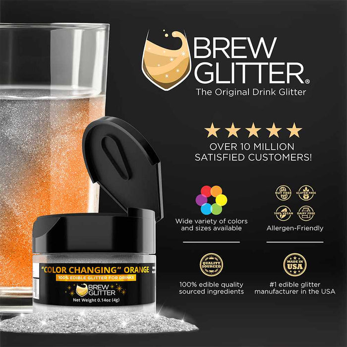 Brew Glitter "Color Changing" Orange edible glitter in a black jar next to a glass of sparkling orange drink.