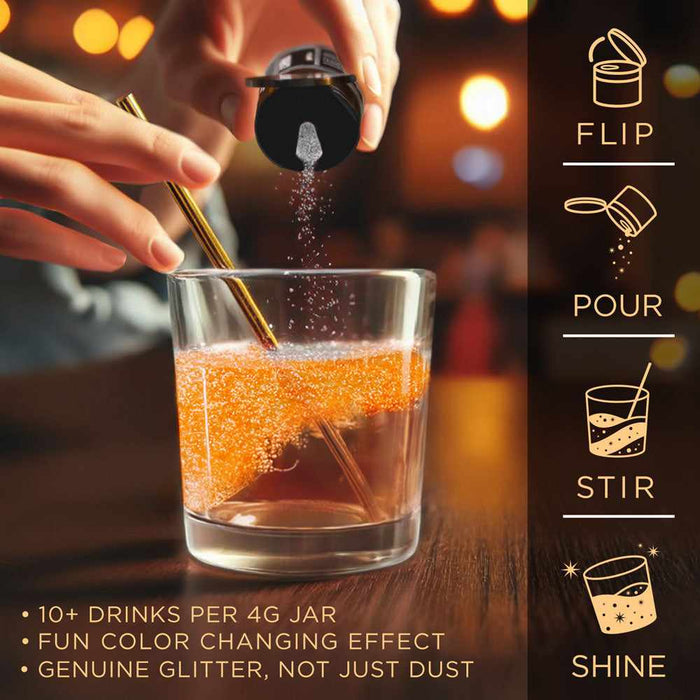 Hand pouring white color-changing brew glitter from a black shaker into a glass of orange liquid.