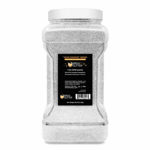 1kg jar of white "Color Changing" Orange Brew Glitter, a food-grade beverage shimmer.