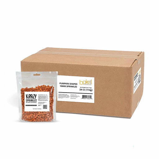 direct shot of bulk orange pumpkin shaped candies in front of large shipping box