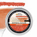 Orange Brew Glitter cocktail rimming sugar in a round aluminum tin with a vibrant, sparkling orange sugar-rimmed glass.