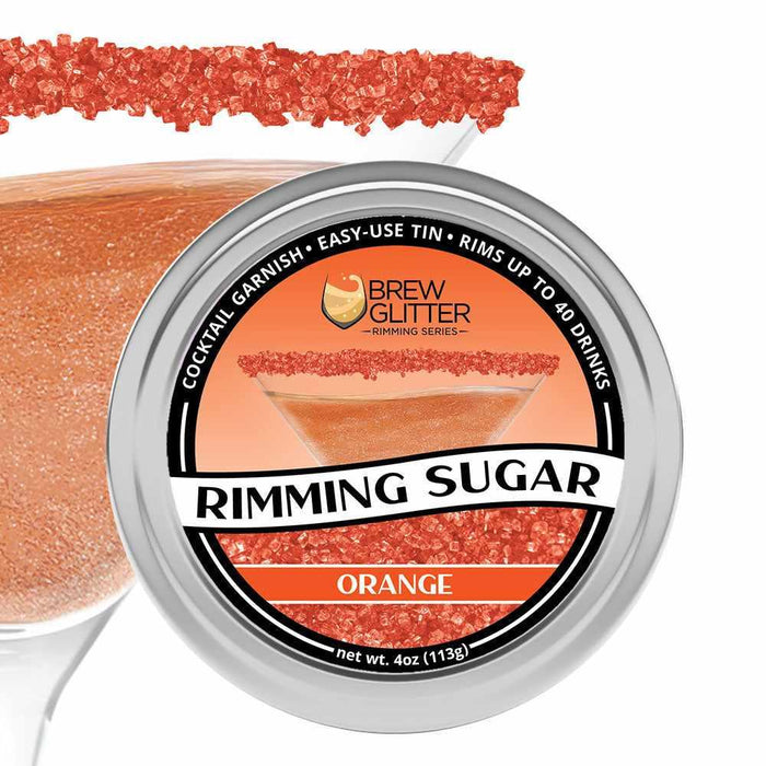 Orange Rimming Sugar in a round aluminum tin, with a cocktail glass rimmed with the sugar in the background.