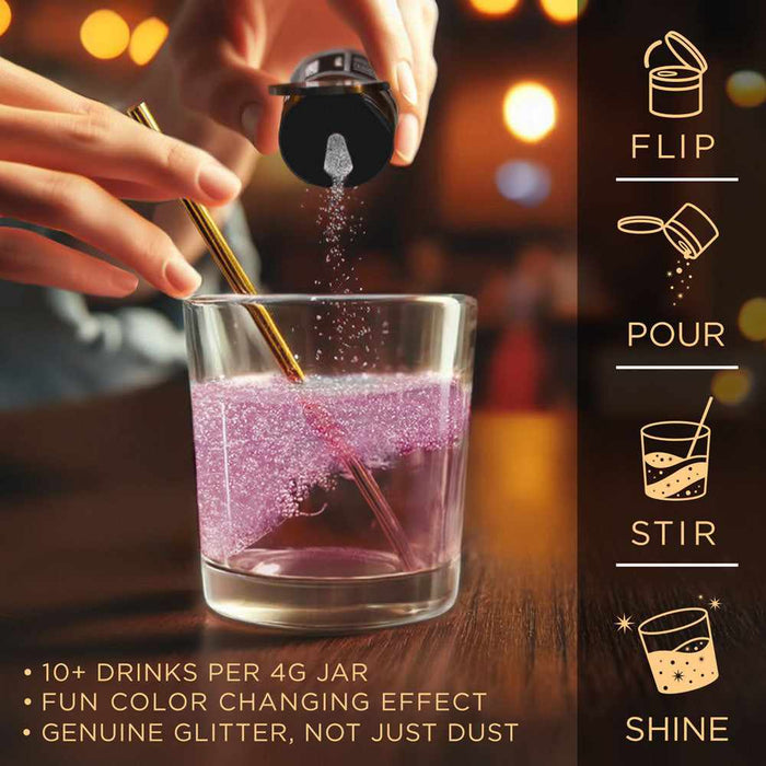 Hand pouring white color-changing brew glitter into a glass of pink liquid with a gold straw.