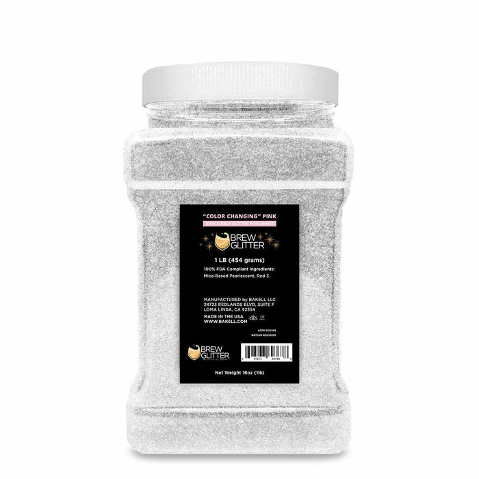 1 lb bulk container of white color-changing pink Brew Glitter for beverages.