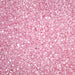 Close-up of sparkling pink pearl cocktail rimming sugar with a textured, crystalline finish for decorating glassware.