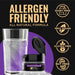 Purple Color Changing Brew Glitter next to a glass of water, highlighting allergen-friendly features.