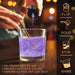 Purple edible Brew Glitter being poured from a 4g jar into a glass to create a shimmering, colorful drink.