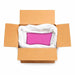 Open cardboard box filled with a large bag of raspberry pink ultrafine iridescent craft glitter.