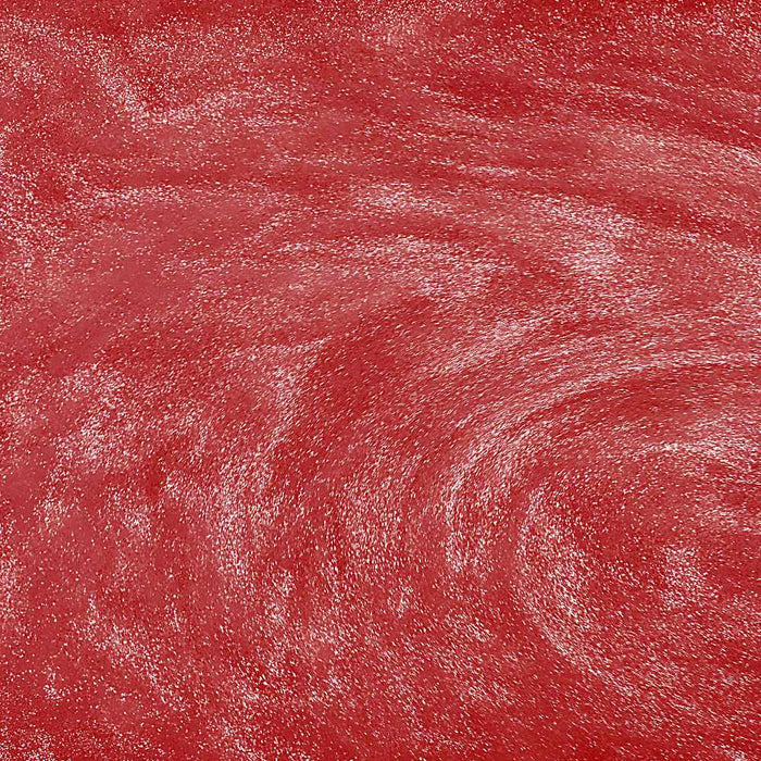 Vibrant red edible drink glitter swirling in a liquid, creating a shimmering, sparkling texture.