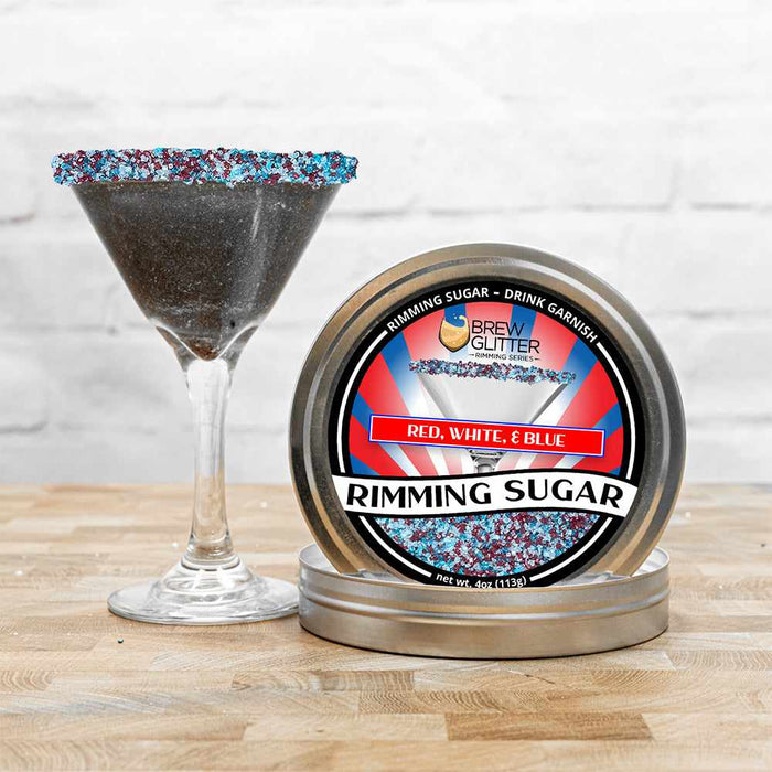 Red, White & Blue Rimming Sugar in a tin next to a martini glass with a patriotic sugar rim.