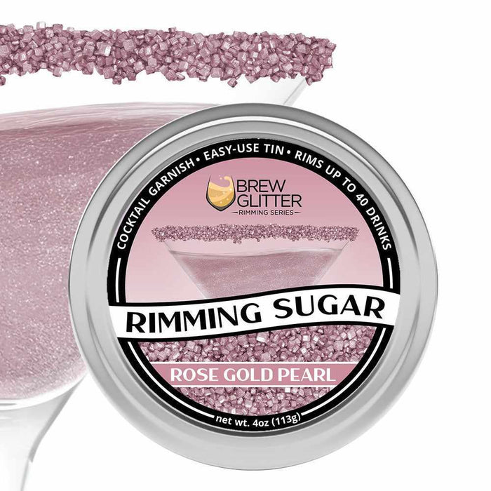 Rose gold pearl rimming sugar in a 4oz tin, garnishing a cocktail glass.