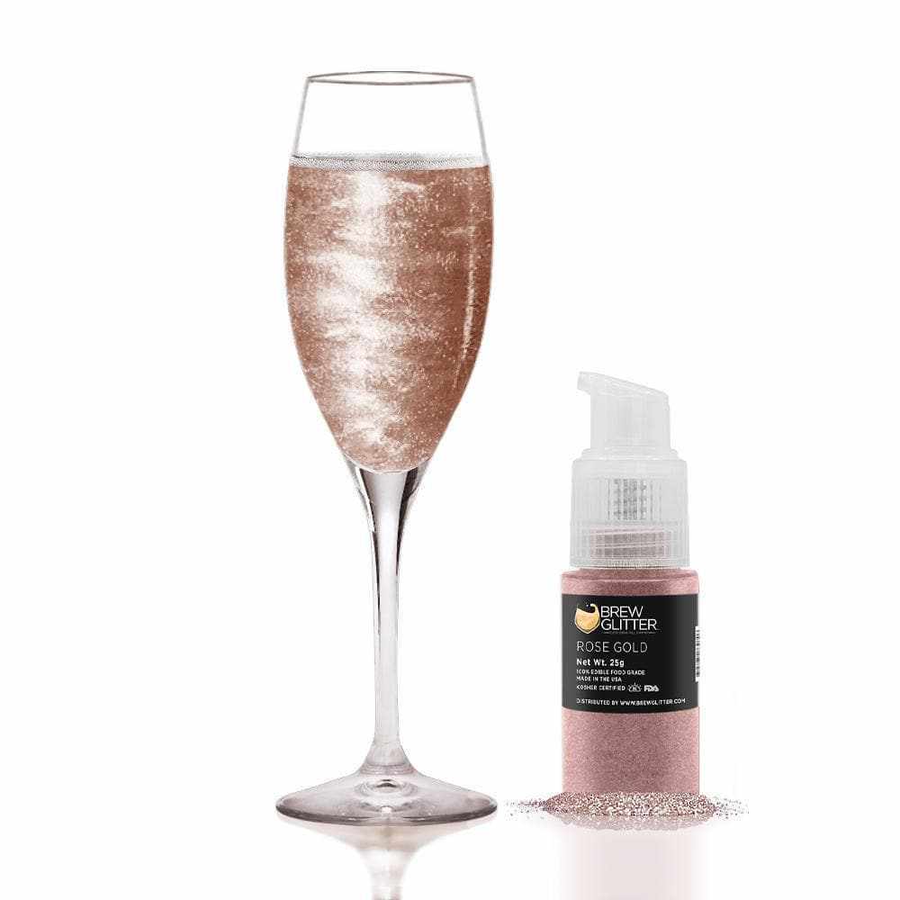 Rose gold edible glitter spray pump next to a champagne flute with shimmering rose gold drink.
