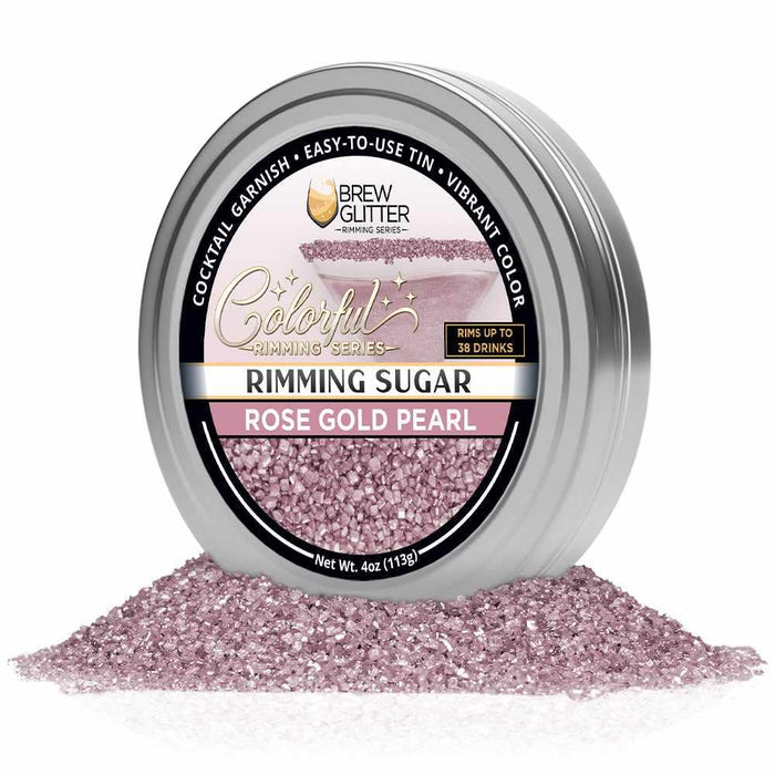 Rose Gold Pearl cocktail rimming sugar in a 4oz silver tin with a branded label, surrounded by sparkling pink sugar crystals.