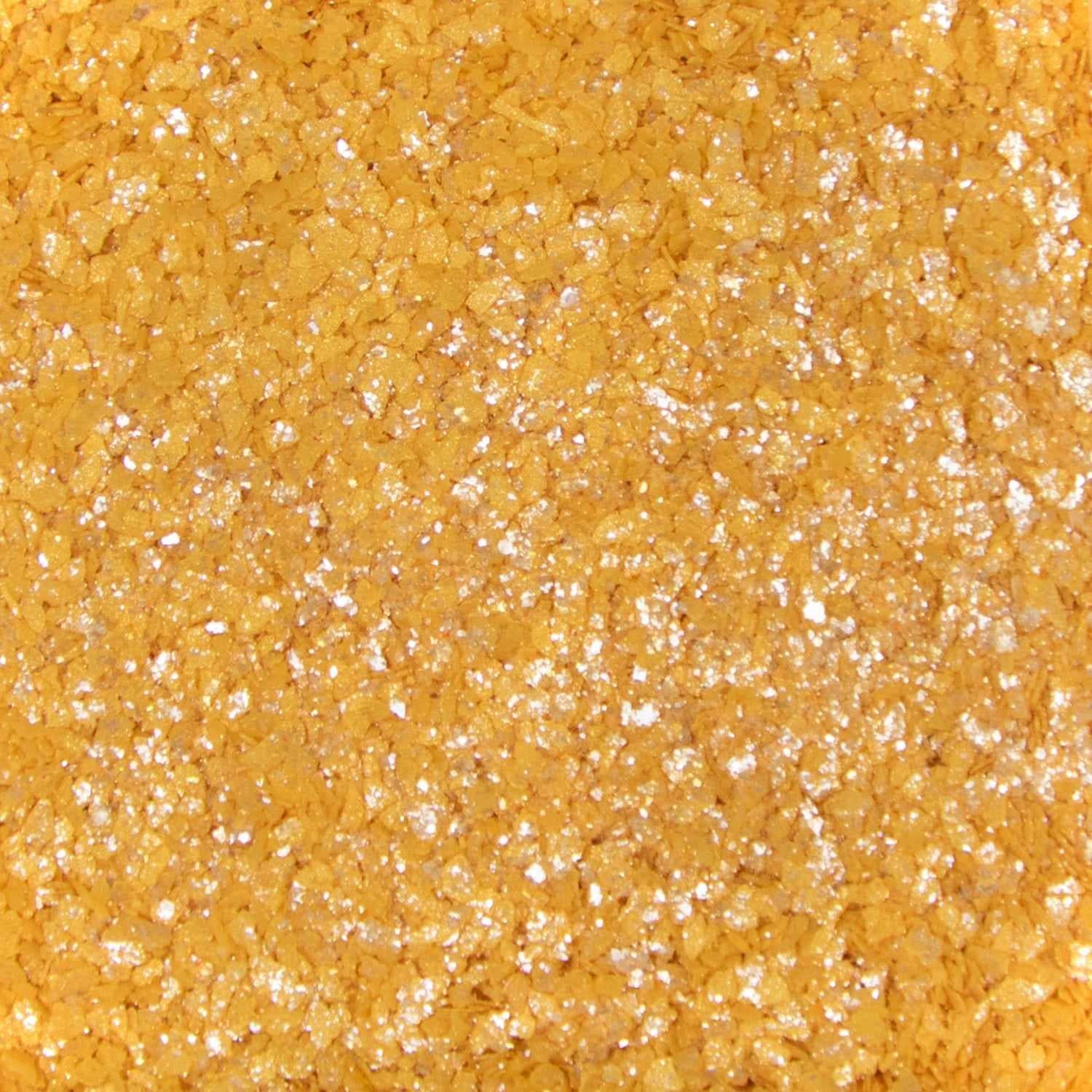 Close-up texture of shimmering gold cocktail rimming salt with sparkling, coarse crystalline grains for drink garnishing.