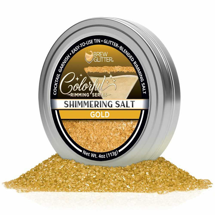 4oz tin of shimmering gold cocktail rimming salt with a black label, sitting in a pile of sparkling gold salt crystals.