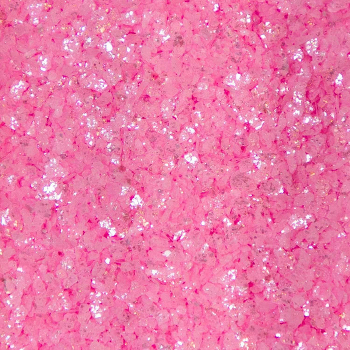 Coarse, shimmering pink cocktail rimming salt with a sparkling, crystalline texture for garnishing glassware.