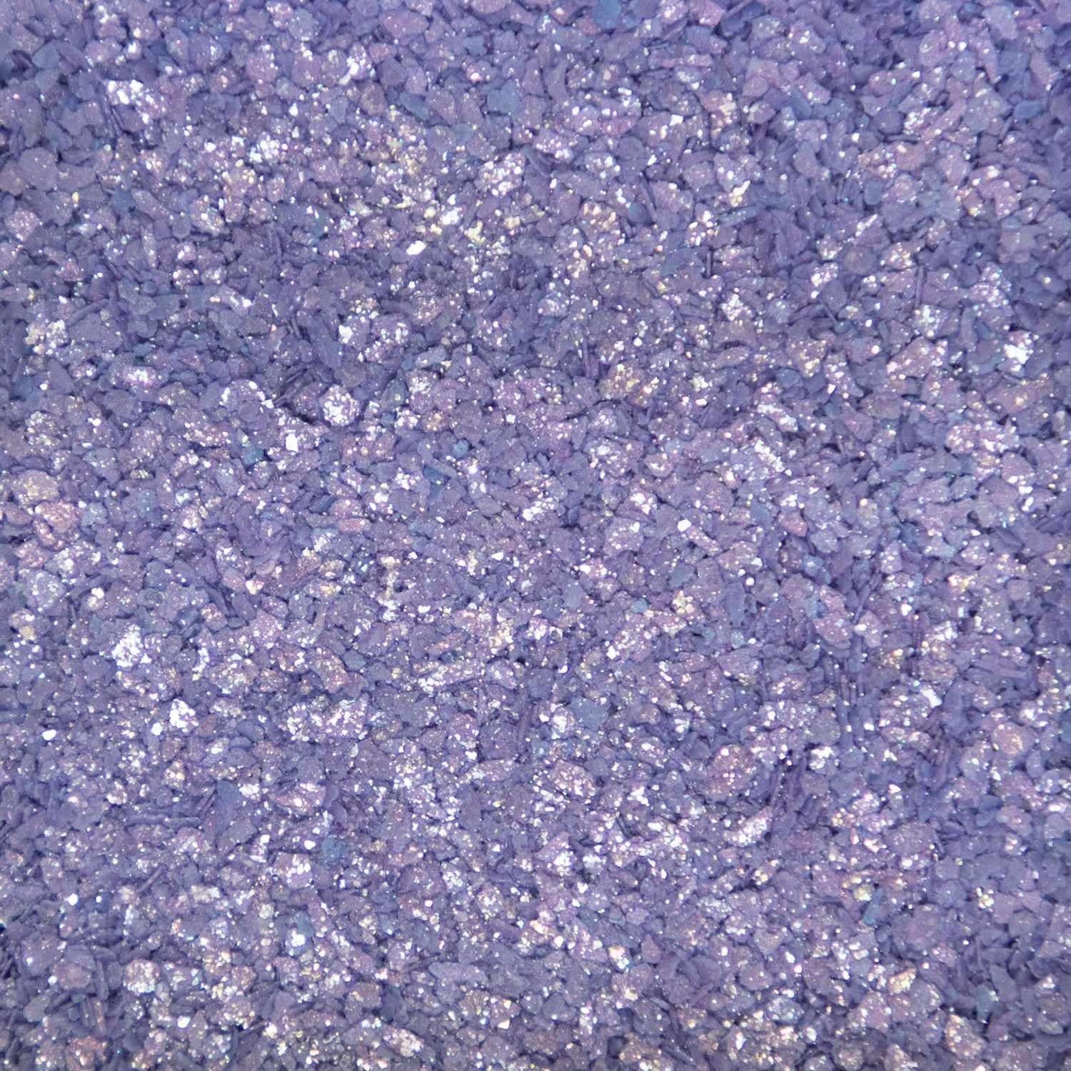 Close-up texture of shimmering deep purple cocktail rimming salt with sparkling crystalline grains.