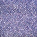 Close-up texture of shimmering deep purple cocktail rimming salt with sparkling crystalline grains.