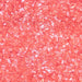 Close-up of vibrant red cocktail rimming salt with a shimmering, glittery texture for garnishing glasses.