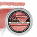 4oz tin of shimmering red cocktail rimming salt with a glittery texture, shown with a garnished martini glass rim.