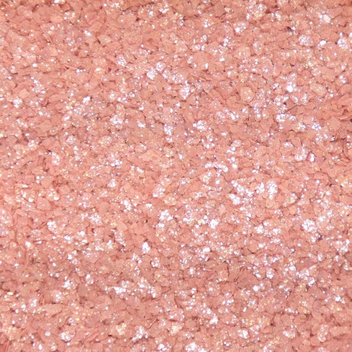 Coarse rose gold cocktail rimming salt with a shimmering, metallic finish for decorating glassware.