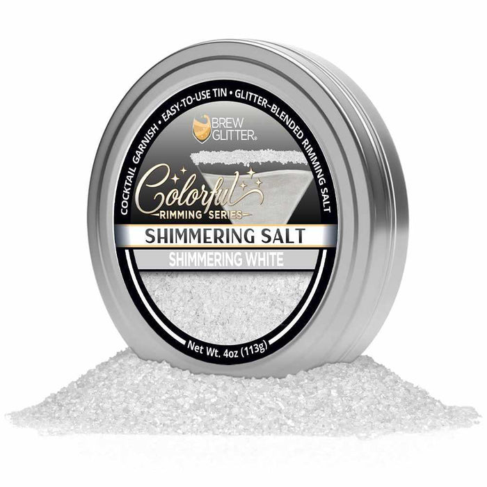 4oz tin of shimmering white cocktail rimming salt with a black and silver label, surrounded by a pile of sparkling salt.