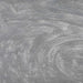 Swirling silver edible glitter dust creating a shimmering, metallic texture for cocktails and beverages.