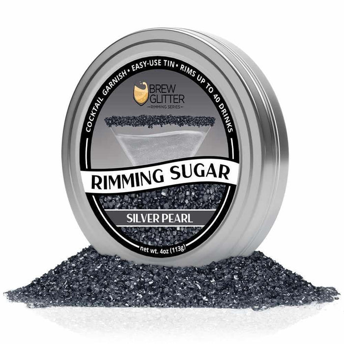 Silver Pearl Cocktail Rimming Sugar in a silver tin, surrounded by loose silver pearl sugar.