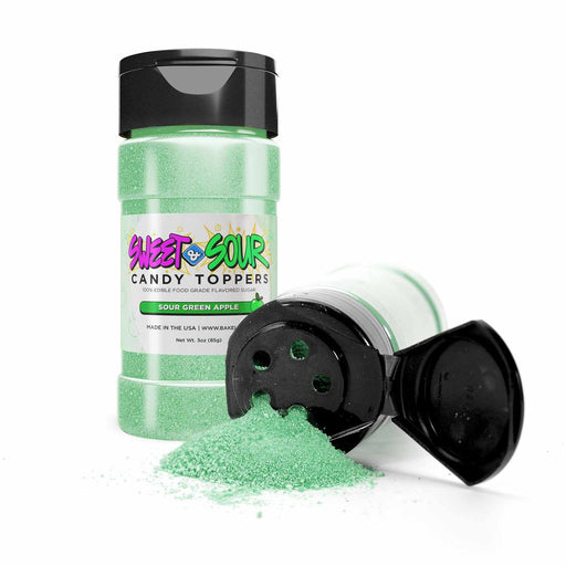 Sweet & Sour Candy Toppers overflowing from 85g container | Tangy green apple flavor burst | Culinary vibrance in green