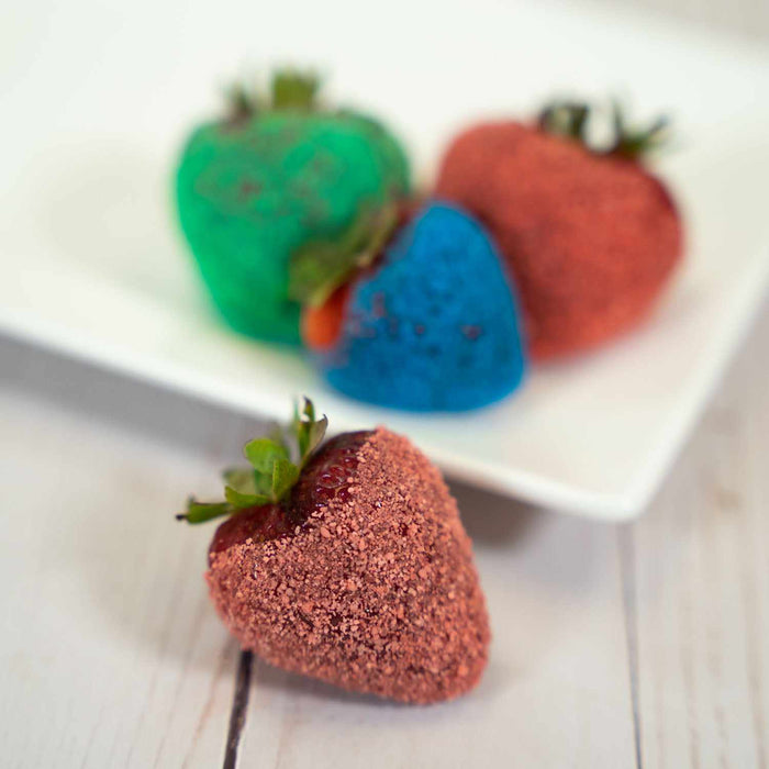 strawberries coated in sour sugar candy toppings