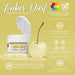 Sunflower Yellow Tinker Dust edible glitter jar, open, next to a glitter-coated cherry on a pile of glitter.