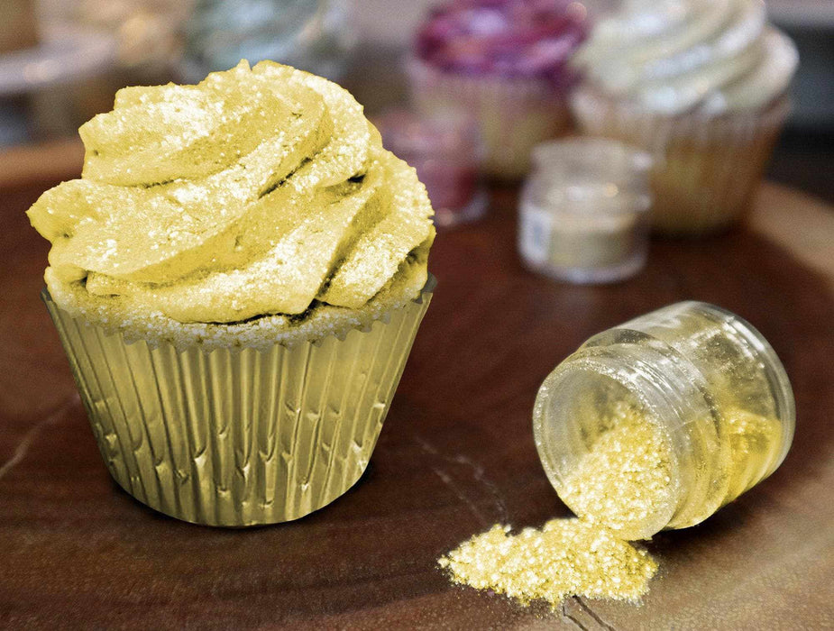 Sunflower Yellow Tinker Dust edible glitter on a frosted cupcake and spilled from a jar.