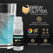 Teal Color Changing Brew Glitter Mini Spray Pump next to a glass of sparkling blue drink.